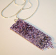 Lilac pendant on a chain by textile artist Mary Taylor