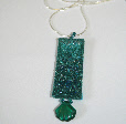 Turquoise pendant on a chain by textile artist Mary Taylor