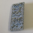 Silver and blue brooch by textile artist Mary Taylor